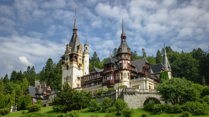 a large castle with towers on top of a hill